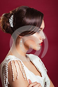 Vintager bride. portrait of the beautiful young girl in an image of the bride with ornament in hair.Red lips