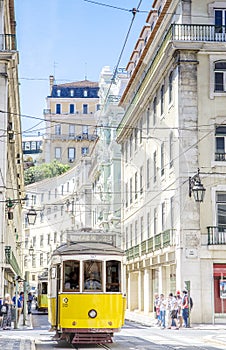 Vintageyellow trams number 28 in the city center of Lisbon