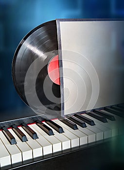 vinyl disc in the package on the piano