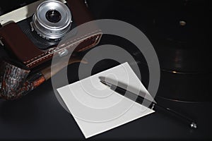 Vinyl plate and retro camera