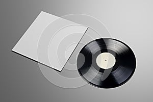 Vinyl record with blank cover on gray background. Mock up template