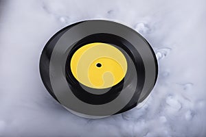 Vinyl record in clouds. Conceptual image. Retro sound