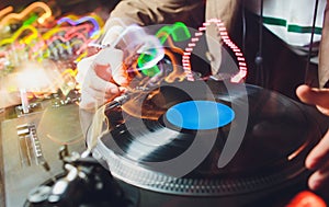 A vinyl record on the panel of the DJ. DJ equipment.