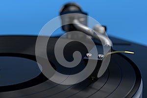 Vinyl record player or DJ turntable with retro vinyl disk on blue.