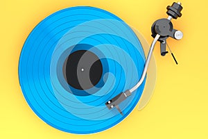 Vinyl record player or DJ turntable with retro vinyl disk on yellow background.