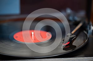 A vinyl record and turn table