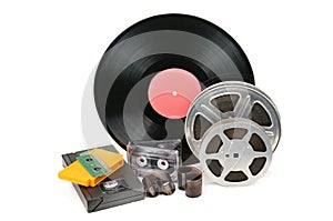 Vinyl record, video and audio cassettes isolated on white background