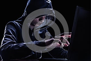 Violation of intellectual property rights concept. Hacker in a hood.