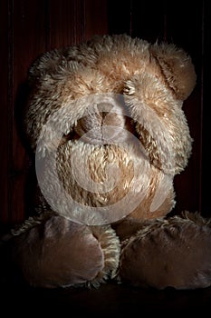 Violence and fear metaphor with teddy bear