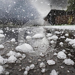 violent hailstorm with water on the ground on street photo.