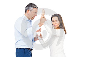 Violent man grabbing wifes wrists