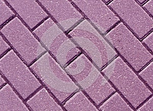 Violet color cobblestone pavement close-up