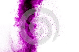 Violet color powder explosion then splatter on white background.