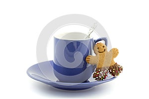 Violet cup and saucer with gingerbread man cookie