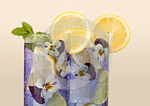 Violet drink with edible flowers