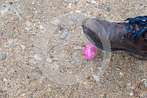 Violet easter egg is getting scrunched by a shoe