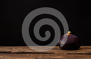 Violet fig fruit asolated on black background
