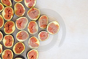 Violet figs on a white surface