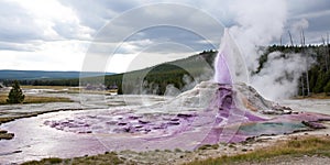 Violet geyser with boiling fluid photo