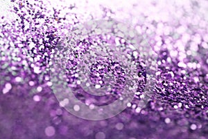 Violet glitter shine dots confetti. Abstract light blur blink sparkle defocus background