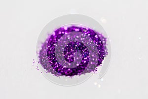 Violet glitters on white background