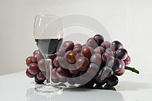 Violet grape and glasses of vine