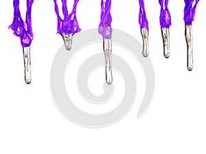 Violet icicles hang down from cords isolated