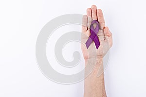 Violet purple ribbon over palm. White background