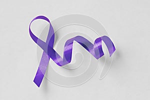 Violet ribbon on white background - Concept of Domestic Violence awareness; Alzheimer`s disease, Pancreatic cancer, Epilepsy