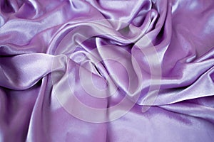 Violet satin background and texture. Grooved of blue fabric abstract. Top view with empty space.