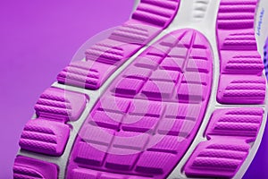 Violet sole of a sports sneaker close-up