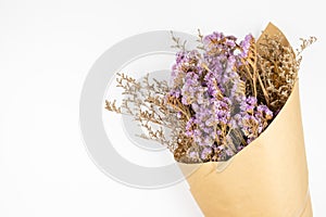 Violet statice flower and white caspia bouquet on white background