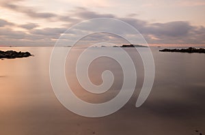 A violet sunrise on the beach of Ses figueretes, Ibiza