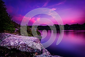 Violet Sunset Over a Calm Lake photo