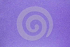 Violet textured glitter background. Shiny sparkly backdrop