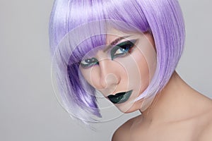 Violet wig and green make-up