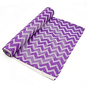 Violet zigzag fabric sample isolated on white background photo