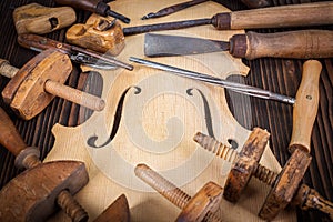 Violin belly and work tools photo