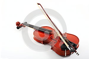 Violin with bow on white