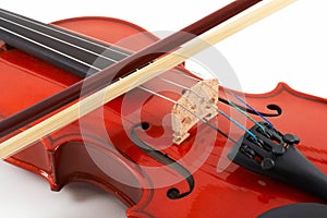 Violin with bow on white backg