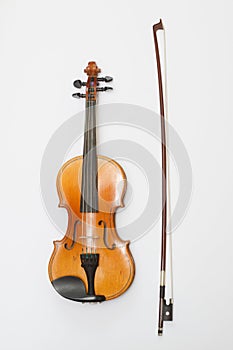 Violin and a bow on white background