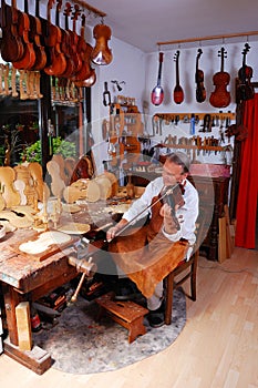 Violin builder and his workshop