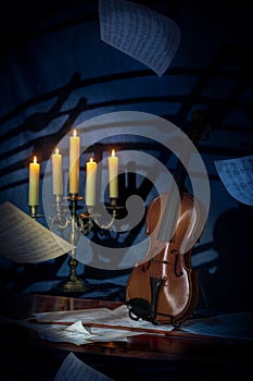 Violin Candelabra and Floating Sheet Music photo
