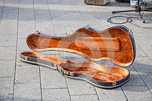 Violin case, black, open and empty.