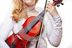 Violin of a classical musical instrument. Hands of a classical violin player on a white background. Details of the