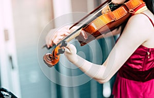 Violin close-up, Young woman playing the violin at home