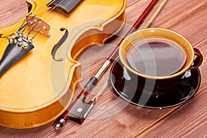 Violin and cup of coffee.