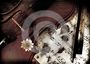 Violin with music on grunge photo