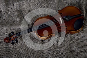 Violin, fiddlestick and bowtie, canvas background