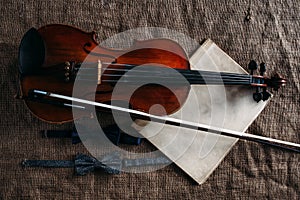 Violin, fiddlestick, notes and bowties closeup